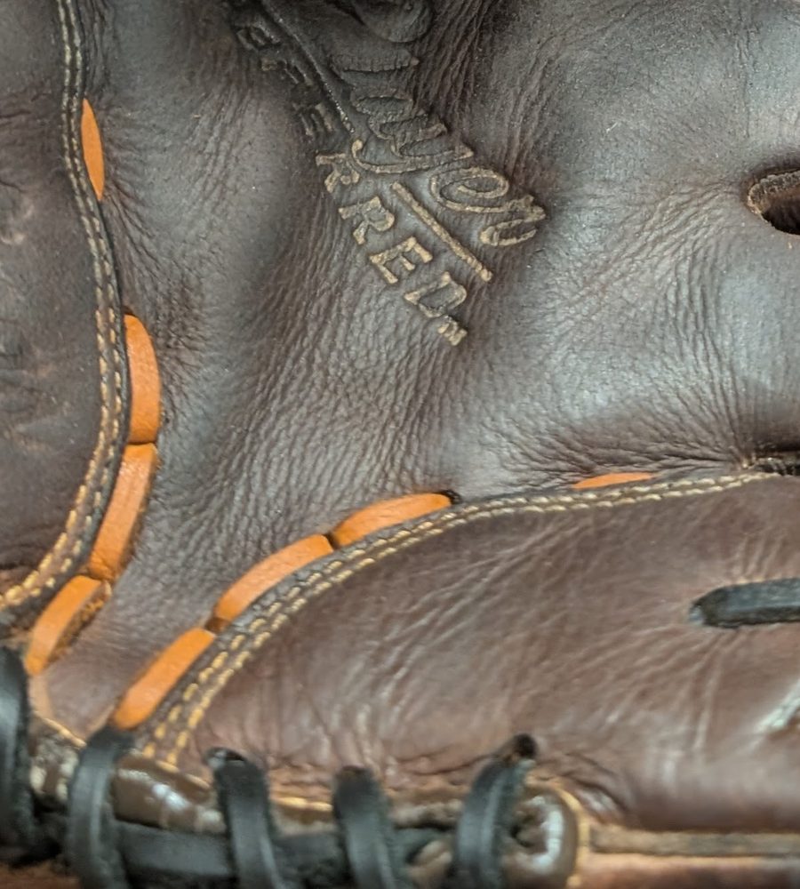 Same glove after relacing with fresh tan and black rawhide lace