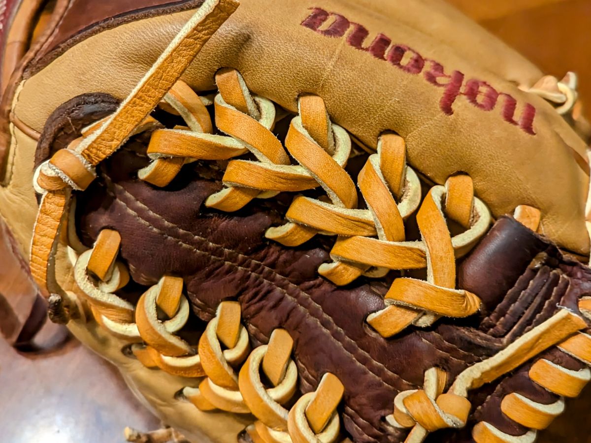 Detail of hand-laced web work on a Nokona baseball glove